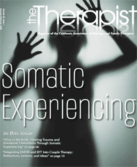 Magazine cover shows a person in shadow with hands up against a blurry glass panel